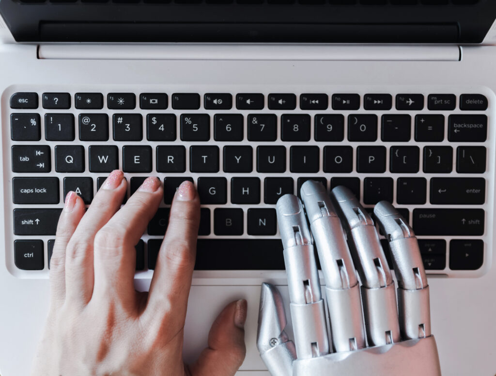 AI content vs human content – robotic hand and human hand representing content writing approaches
